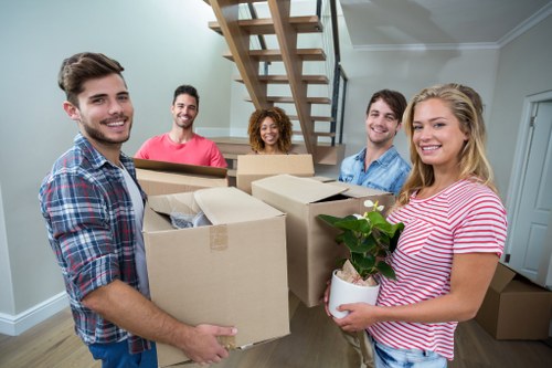 Moving team loading household items for a UK removal service