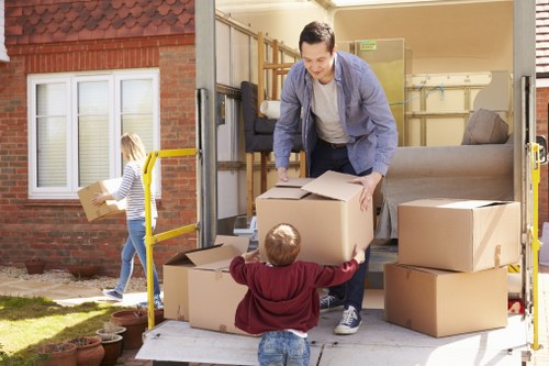 Commercial office relocation team loading items for transport in West London