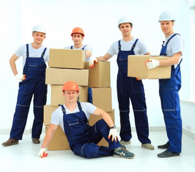 Packed office equipment prepared for a commercial move in Ealing