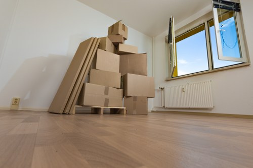 Mover wearing PPE while carrying furniture safely