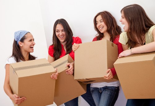 Packed moving boxes and protective materials prepared for transport