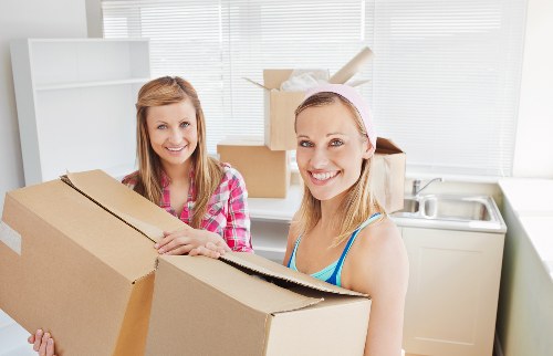 Furniture and boxes being loaded into a van for an Ealing house move